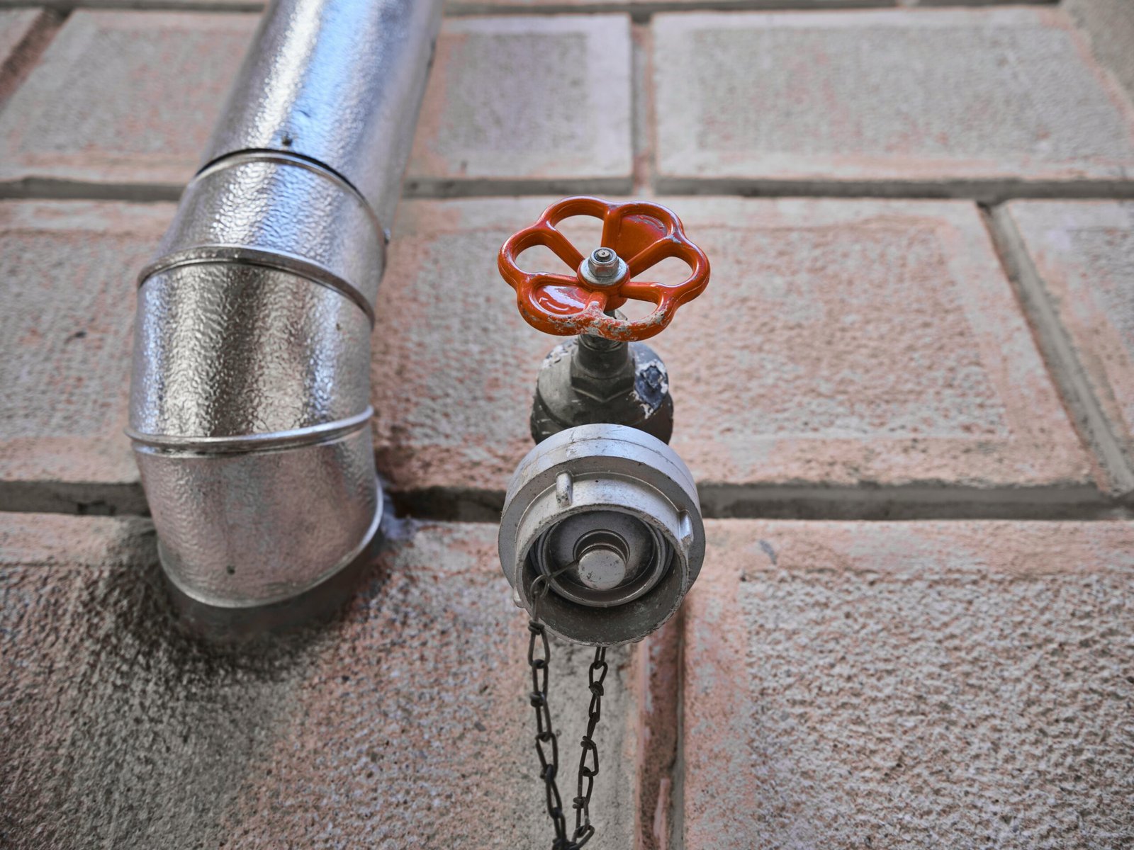 How to Fix Low Water Pressure in House featuring weak water flow, clogged fixtures, plumbing leaks, pressure regulators, and home plumbing solutions.